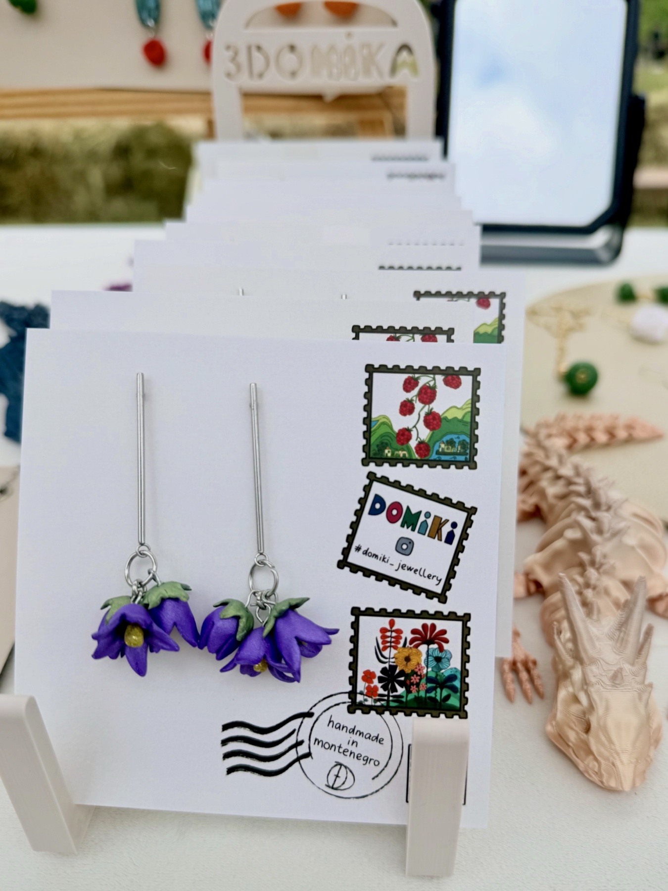 Purple Lovćen bellflower earrings on a DOMIKI display card