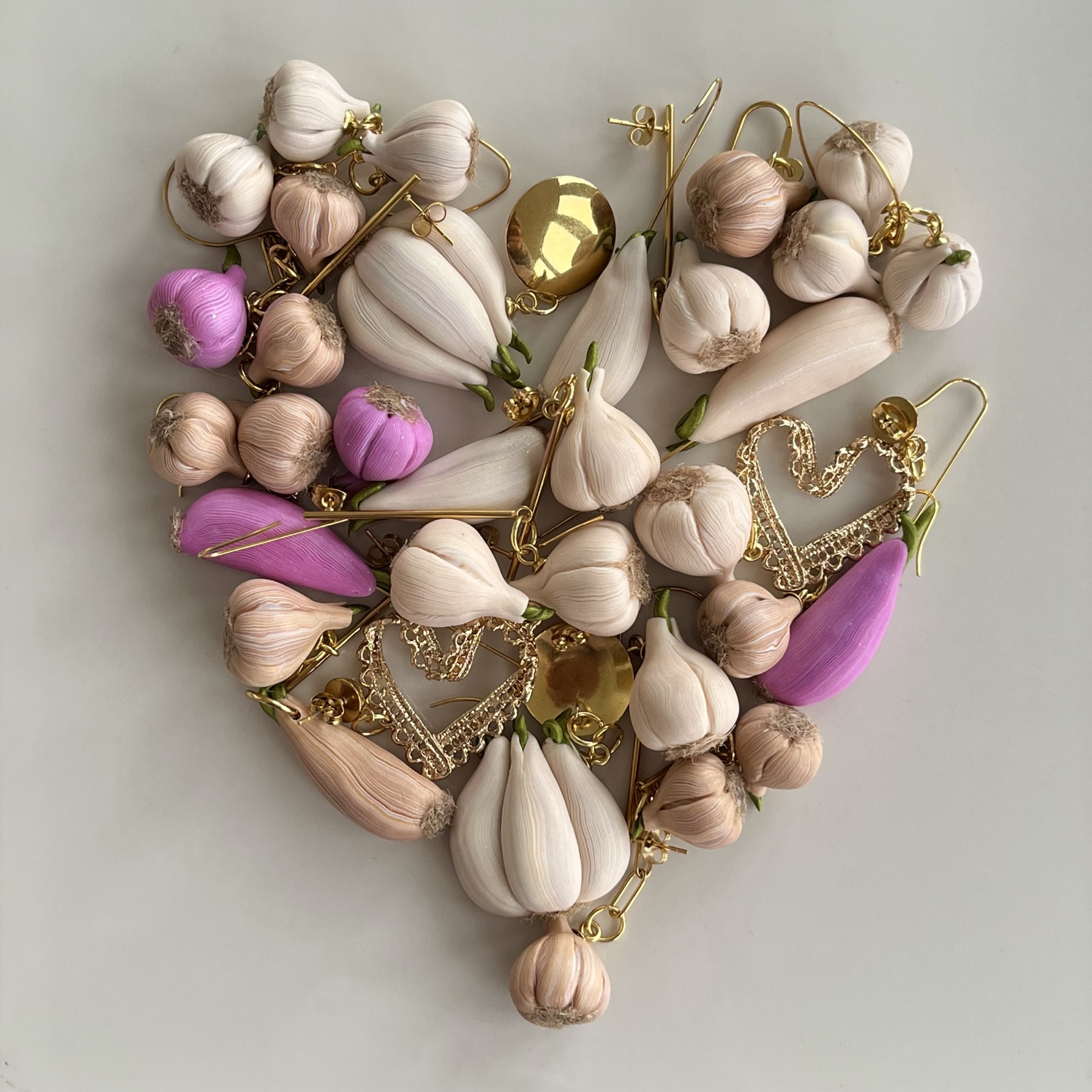 Hand-shaped garlic jewellery in soft natural colours