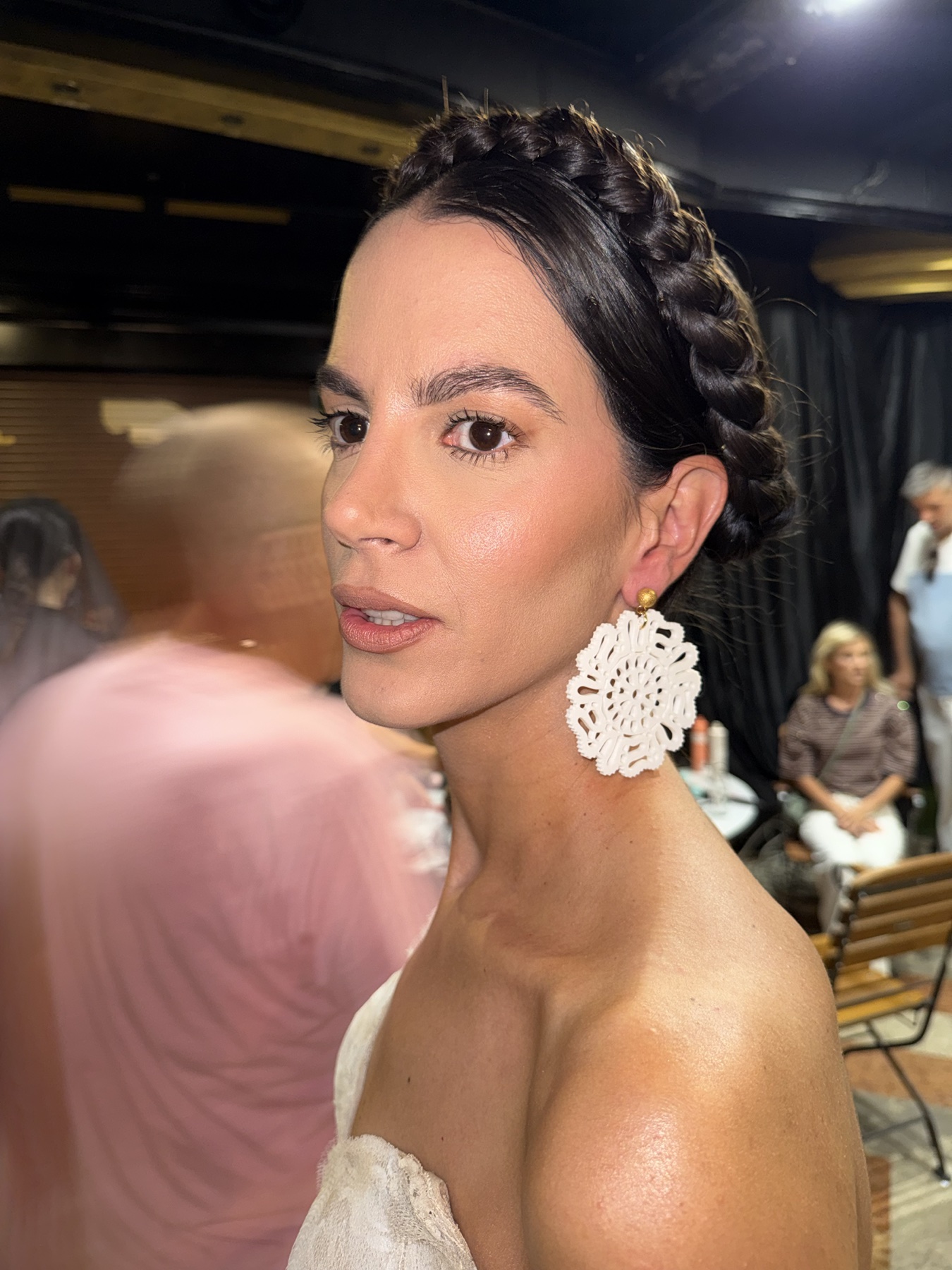 Model wearing statement earrings inspired by Montenegrin lace